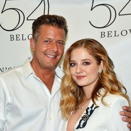 Jackie and her father in an award-function